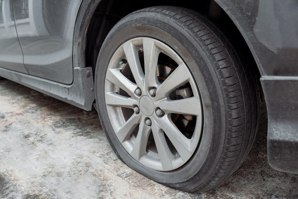 Read more about the article Can You Drive on a Flat Tire? Risks and Precautions to Consider